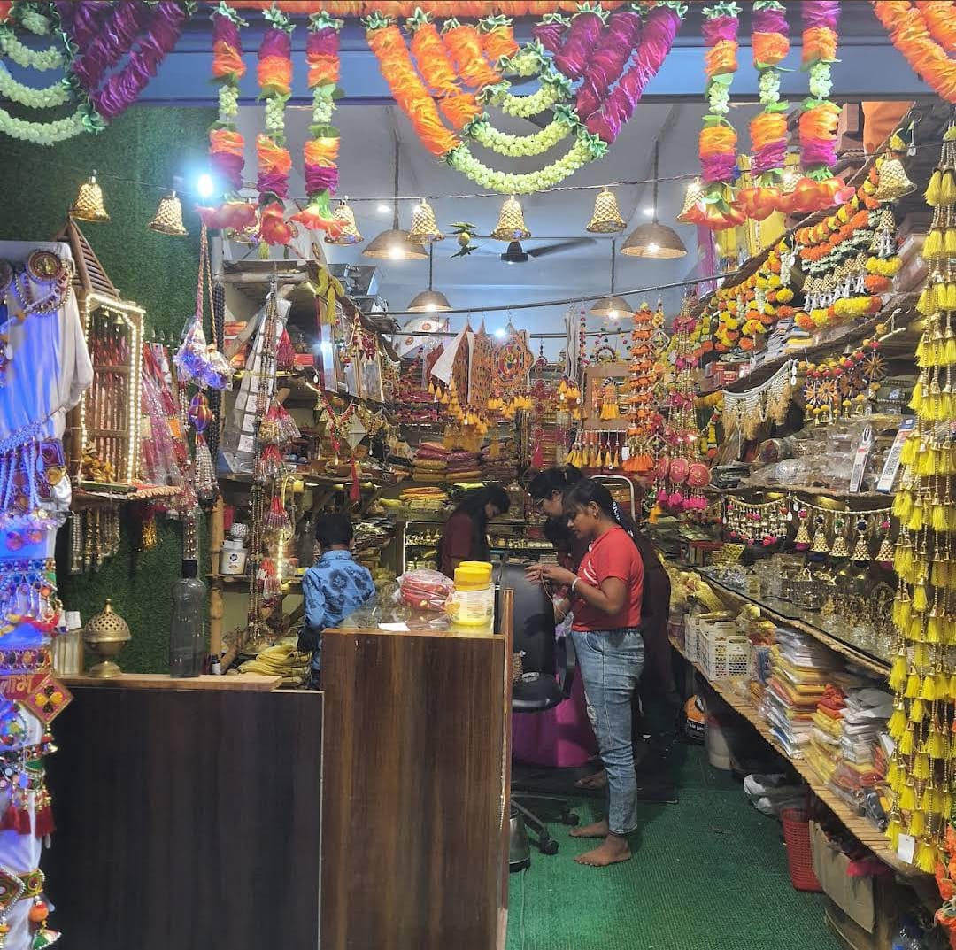 Interior of the shop with garlands and pooja items